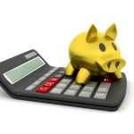 3D render of a piggy bank on a calculator